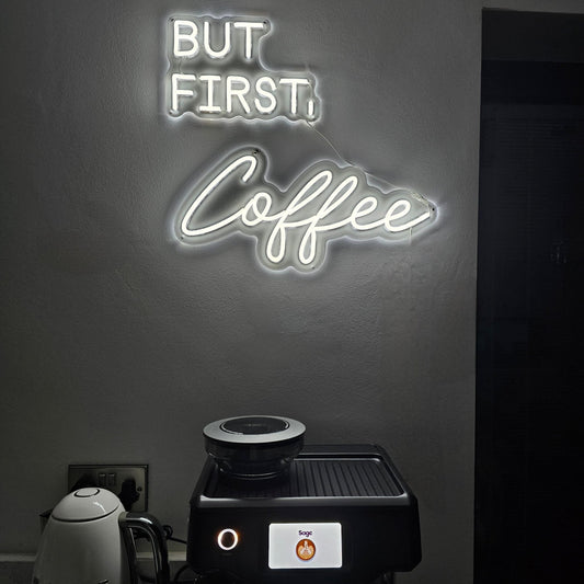 BUT FIRST, Coffee LED neon sign by UV Neon in a modern kitchen setup with espresso machine and kettle