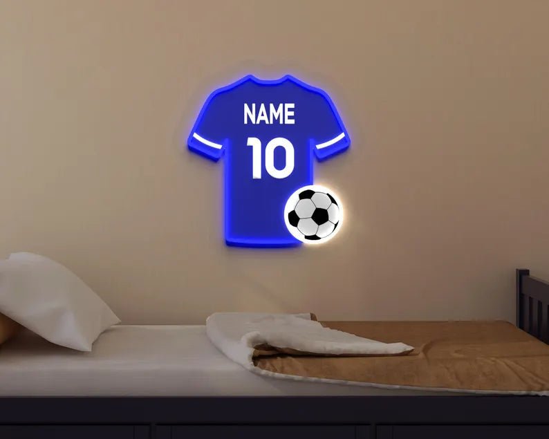 Everton or Chelsea FC-inspired neon sign in the shape of a football shirt glowing royal blue with LED lighting