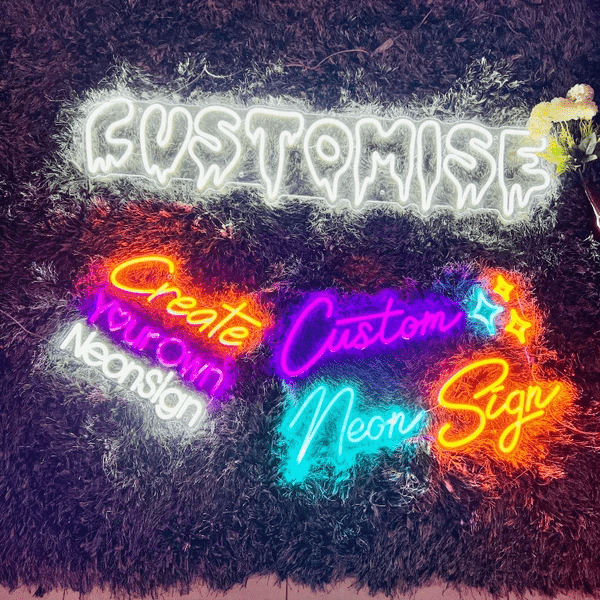 Custom neon signs on textured background featuring the words 'Customise', 'Create your own neon sign', and 'Custom Neon Sign' in vibrant LED colours and fonts