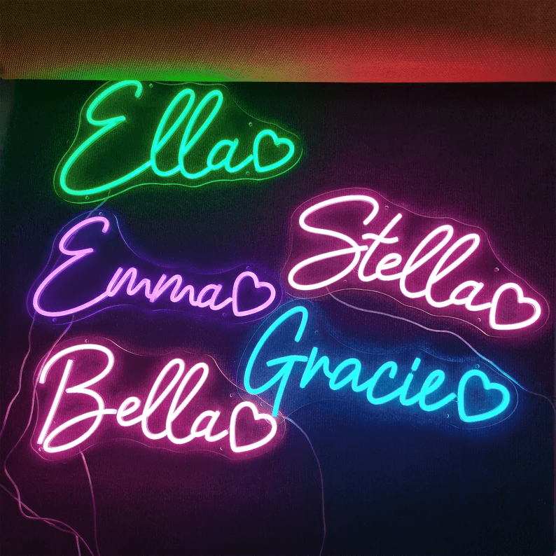 Colourful custom name neon signs with heart shapes, featuring names like Ella, Emma, Stella, Bella, and Gracie in glowing LED script