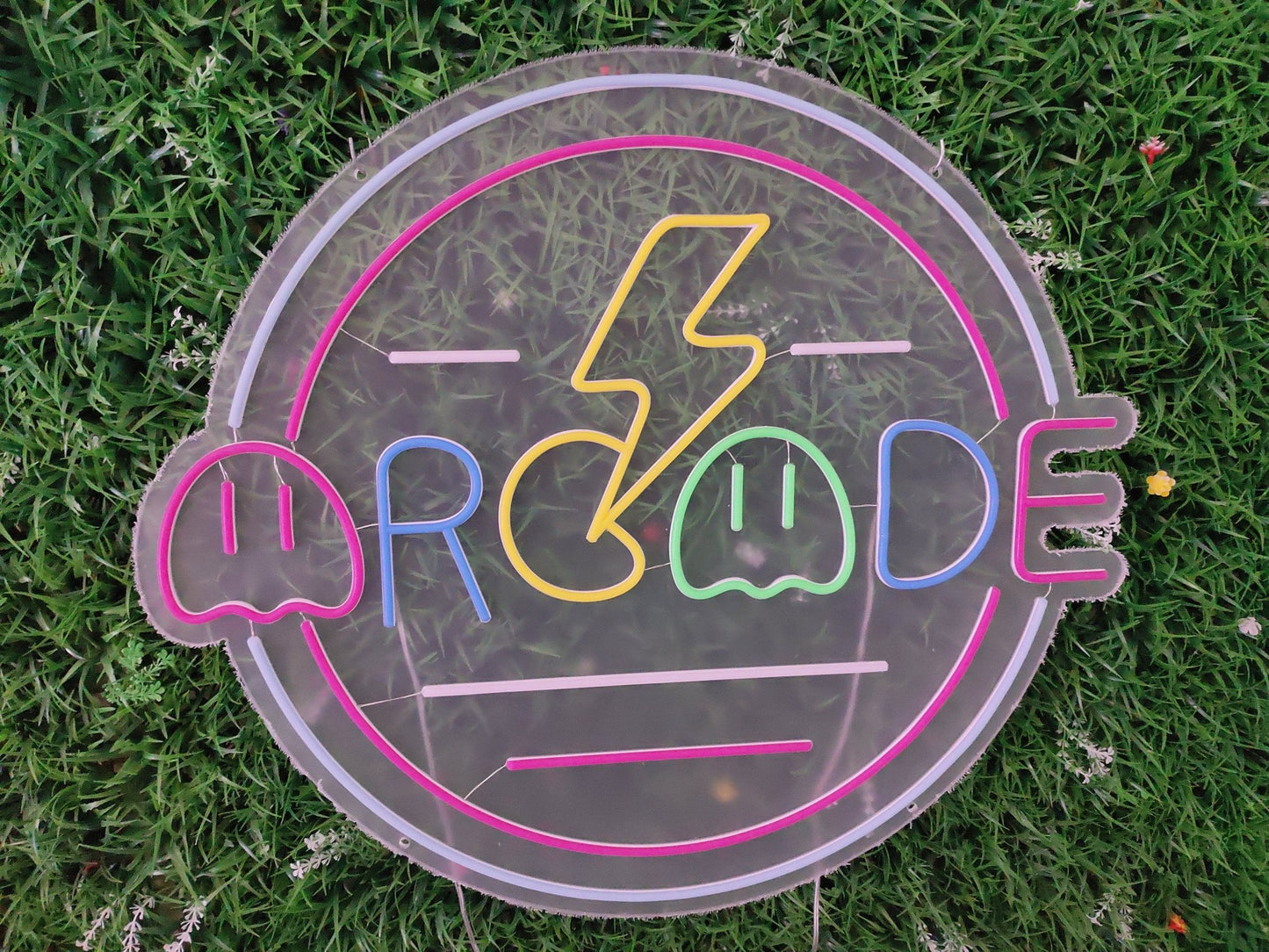 Arcade retro gaming neon sign switched off showing pixel-style maze gaming design with lightning bolt on clear acrylic panel