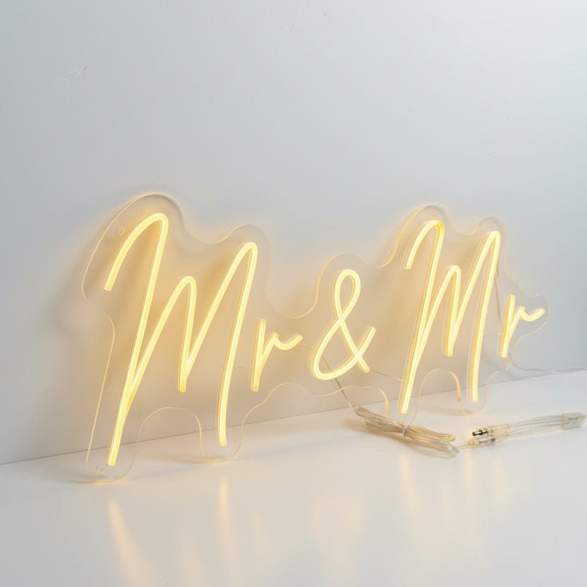 Same-sex wedding neon sign featuring warm white illuminated text reading Mr and Mr, custom-made by UV Neon in Manchester.