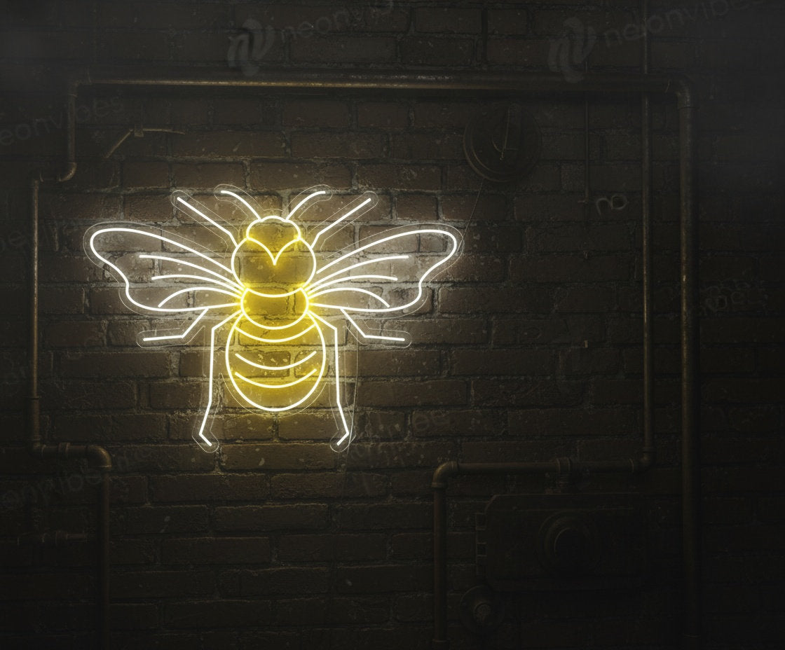 Yellow and white LED neon Manchester worker bee sign on clear acrylic backing, mounted on an industrial brick wall