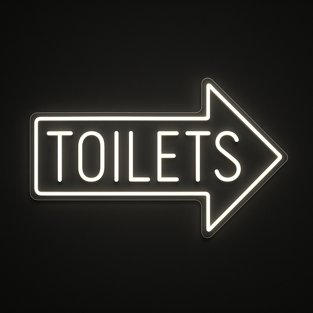 TOILETS neon sign with right-pointing arrow in LED flex and acrylic backing on black background – ideal for cafés, restaurants, bars, and retail spaces