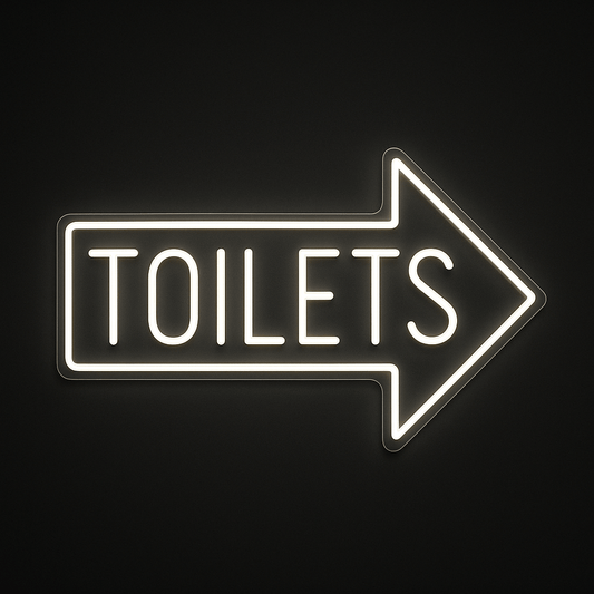 TOILETS neon sign with right-pointing arrow in LED flex and acrylic backing on black background – ideal for cafés, restaurants, bars, and retail spaces