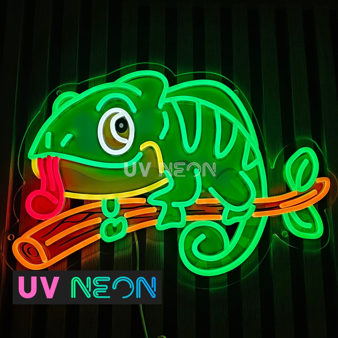 Custom UV Neon sign of a colourful chameleon with LED flex neon and UV-printed acrylic detail, perched on a branch, created by UV Neon.