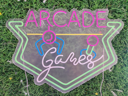 Arcade games neon sign switched off showing retro gaming design with controller figures on clear acrylic panel