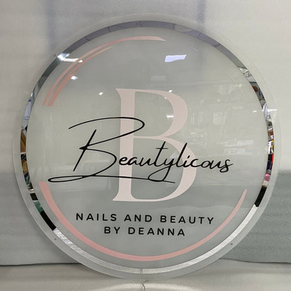 Round backlit acrylic salon sign with printed logo for Beautylicous nails and beauty salon in Basildon, LED wall sign with warm white glow