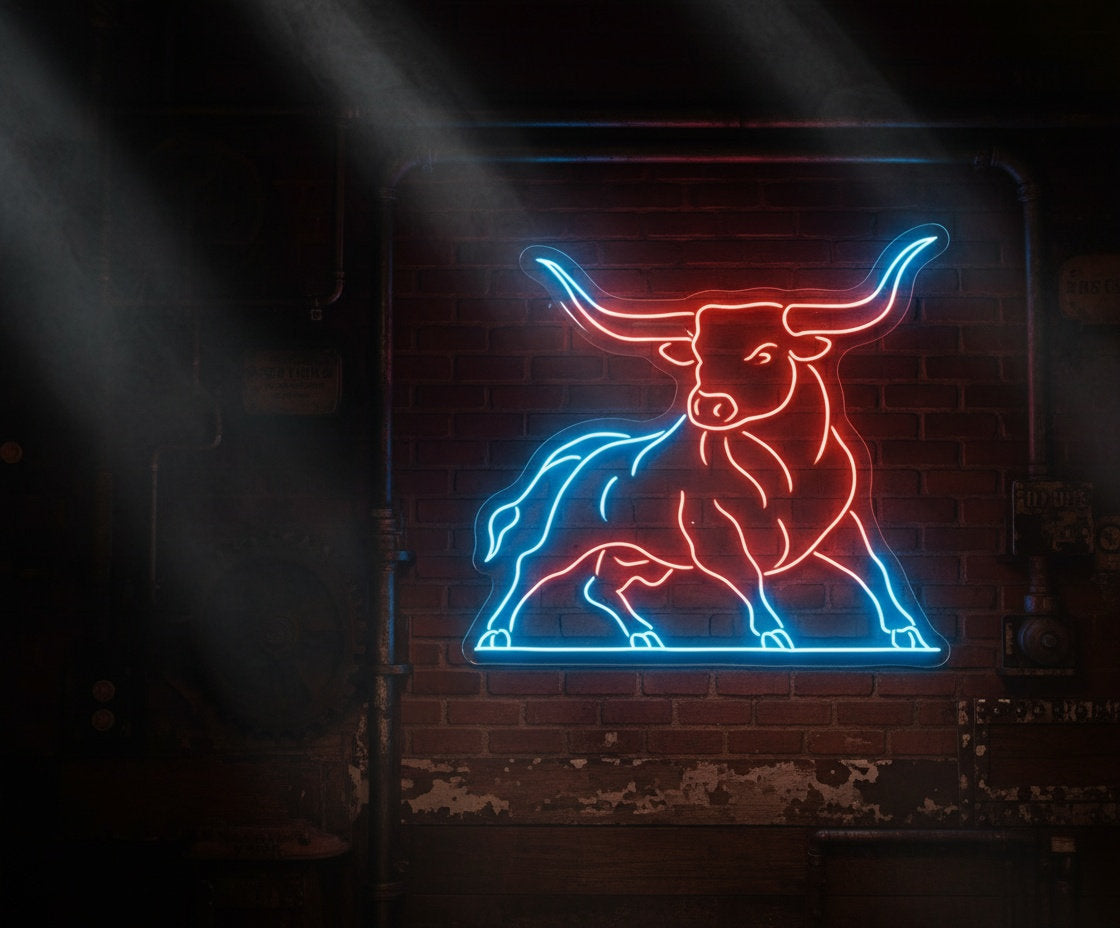 Red and blue LED neon bull sign on clear acrylic backing, mounted on an industrial brick wall in Birmingham style interior