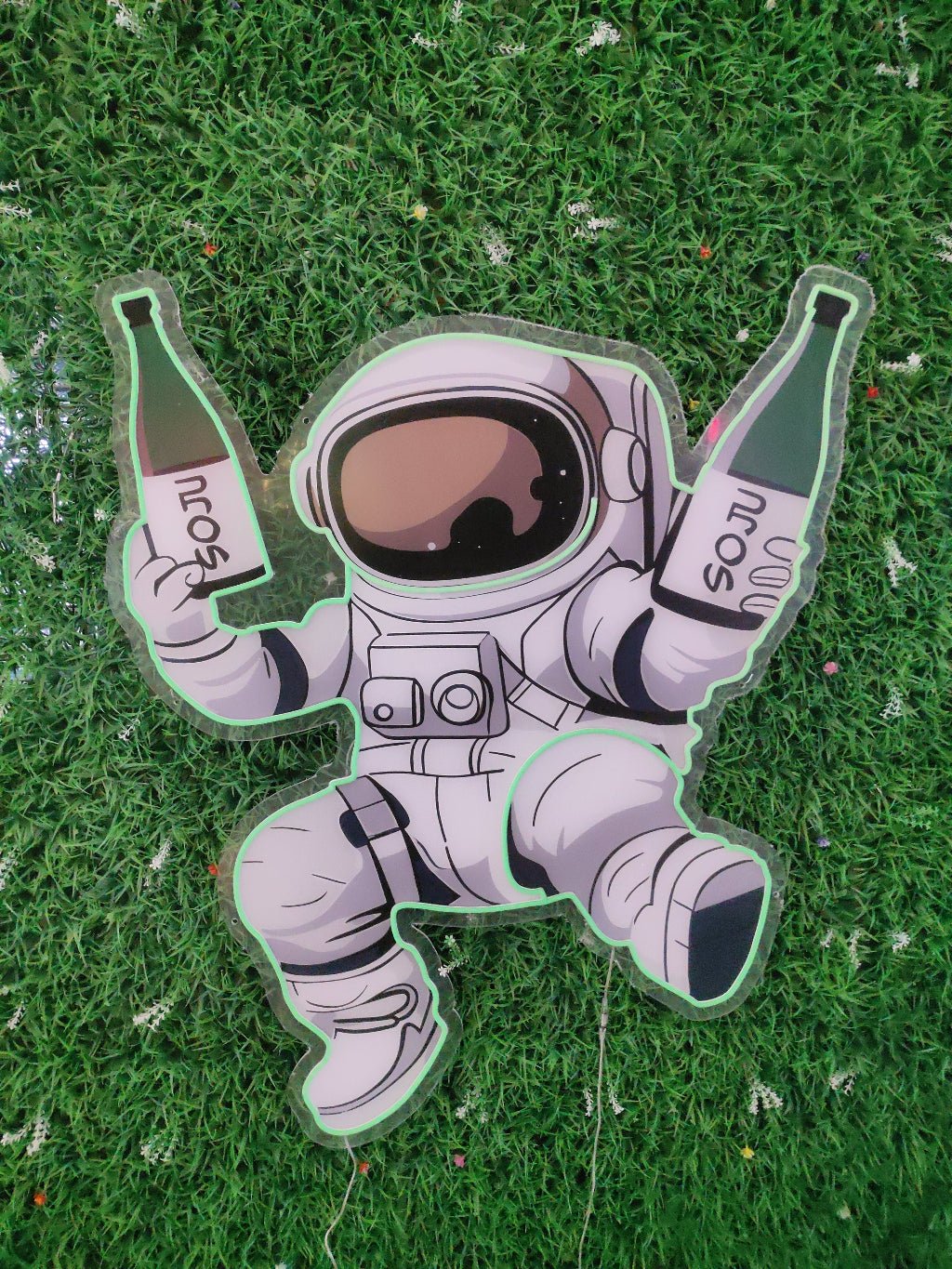 Spaceman astronaut beer bottles neon sign switched off showing UV printed space suit design on clear acrylic backing