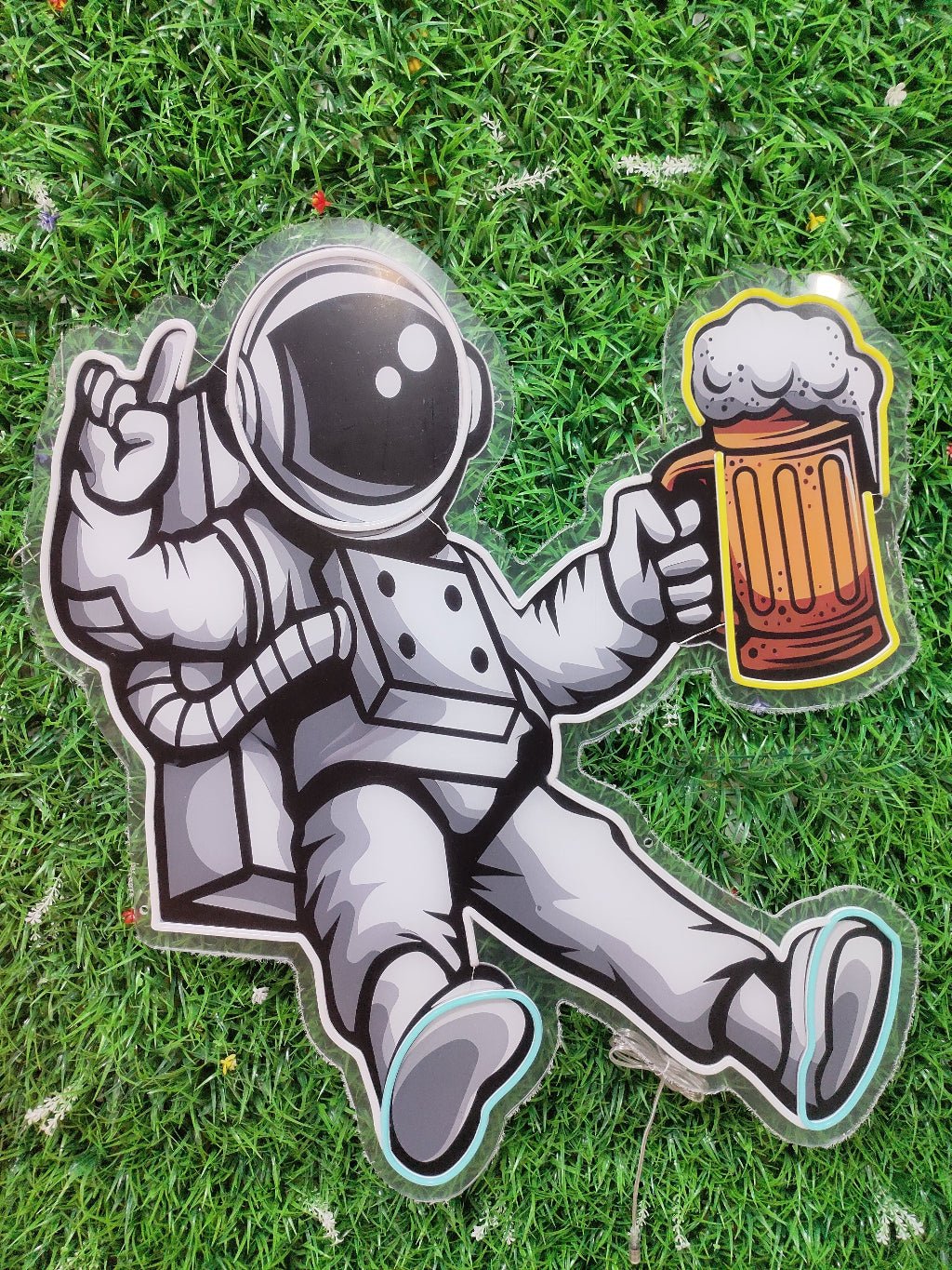 Spaceman astronaut beer neon sign switched off showing UV printed space suit design on clear acrylic backing