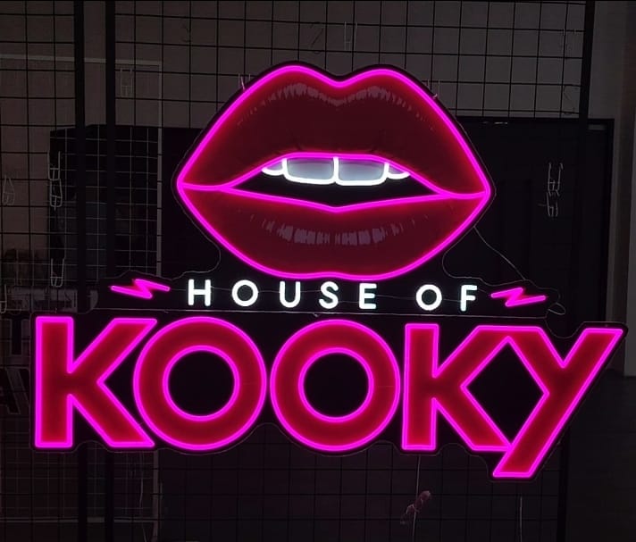1.5m wide custom LED neon logo sign for House of Kooky at Velvet Hotel Manchester, with pink neon lips and blue lettering above the club floor